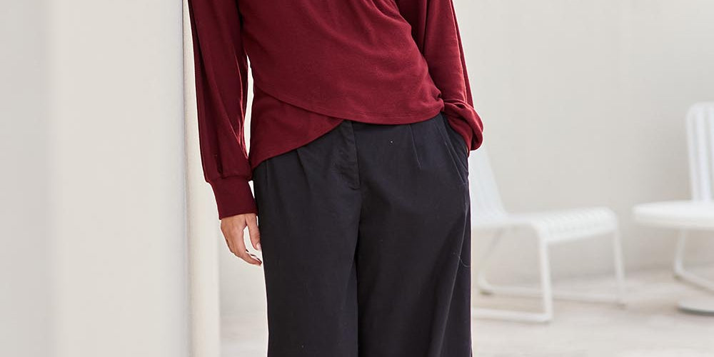 Model Tegand wearing size 10 of the Need You In My Life Pants - Black in colour Black, from the front