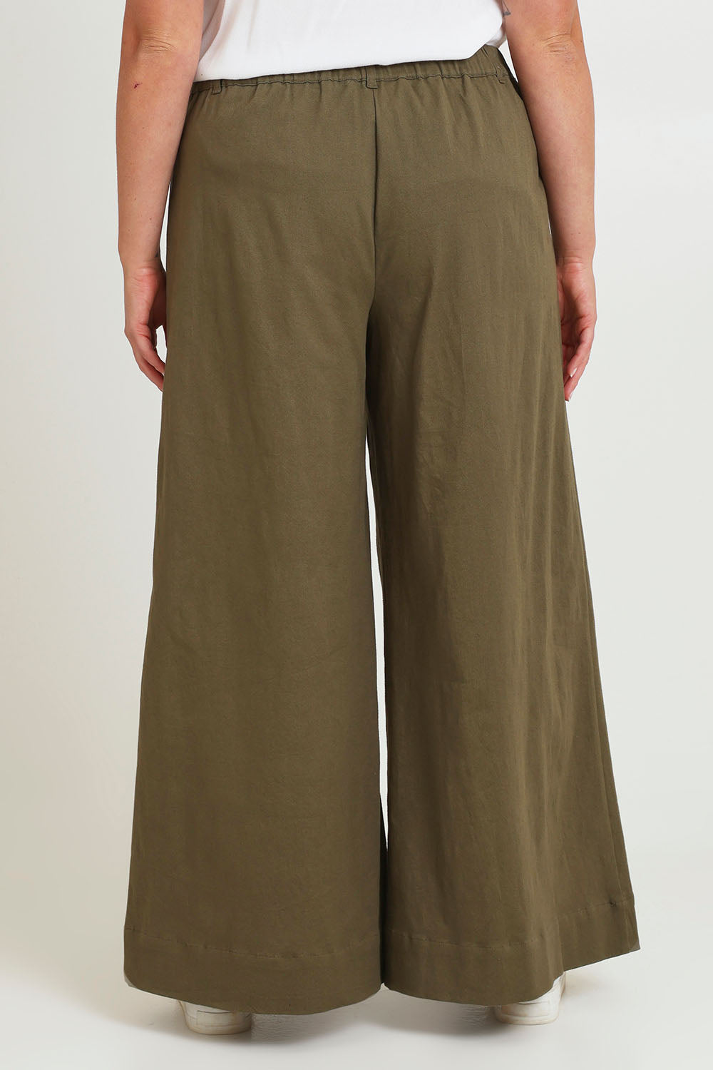 Model Chanel wearing size 16 of the Need You In My Life Pants in colour Moss (Green), from the back