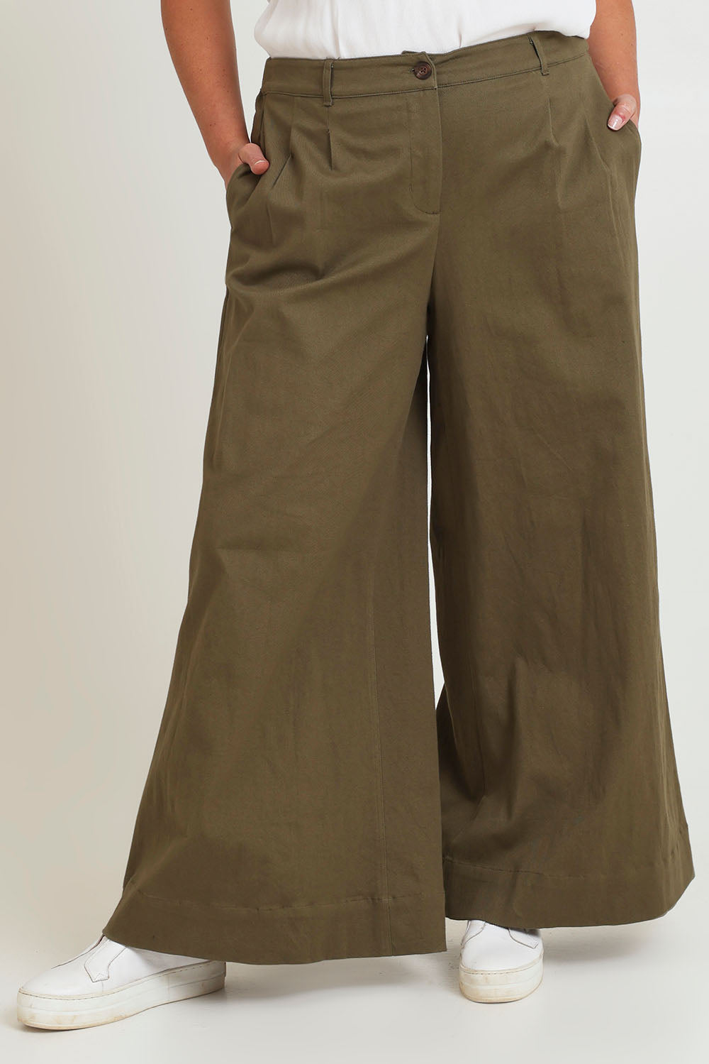 Model Chanel wearing size 16 of the Need You In My Life Pants in colour Moss (Green), from the front, cropped image