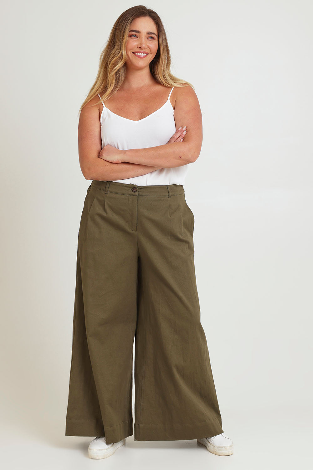Model Chanel wearing size 16 of the Need You In My Life Pants in colour Moss (Green), from the front, showing the whole outfit