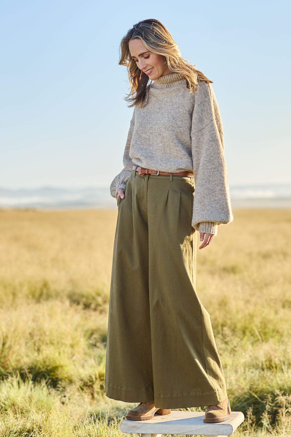 Model Tegan wearing size 10 of the Need You In My Life Pants in colour Moss (Green), from the front, showing the whole outfit