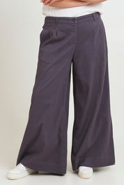Model Chanel wearing size 16 of the Need You In My Life Pants in colour Steel (Grey), from the front, showing the whole outfit