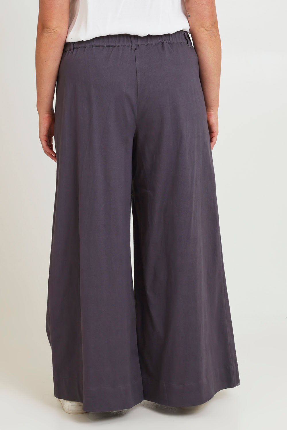 Model Chanel wearing size 18 of the Need You In My Life Pants in colour Steel (Grey), from the back