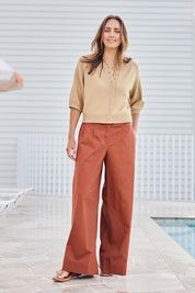 Model Tegand wearing size 10 of the Need You In My Life Pants – Tan in colour Tan, from the front
