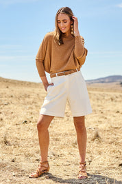 Model Tegan wearing size 10 of the Need You In My Life Shorts in colour White (White), from the front, showing the whole outfit