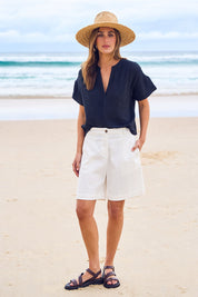 Model Tegan wearing size 10 of the Need You In My Life Shorts in colour White (White), from the front, showing the whole outfit