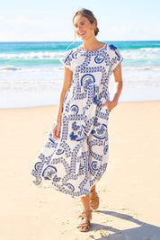 Model Tegan wearing size 10 of the Free Falling Dress in colour Whiteblue (Blue), from the front, showing the whole outfit