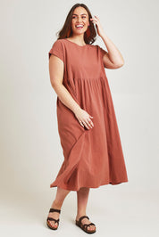 Model Jane wearing size 14 of the Free Falling Dress in colour Cinnamon, from the front, showing the whole outfit