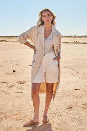 Model Tegan wearing size 10 of the Summertime Love Linen Cotton Trench Coat in colour Natural, from the front, showing the whole outfit