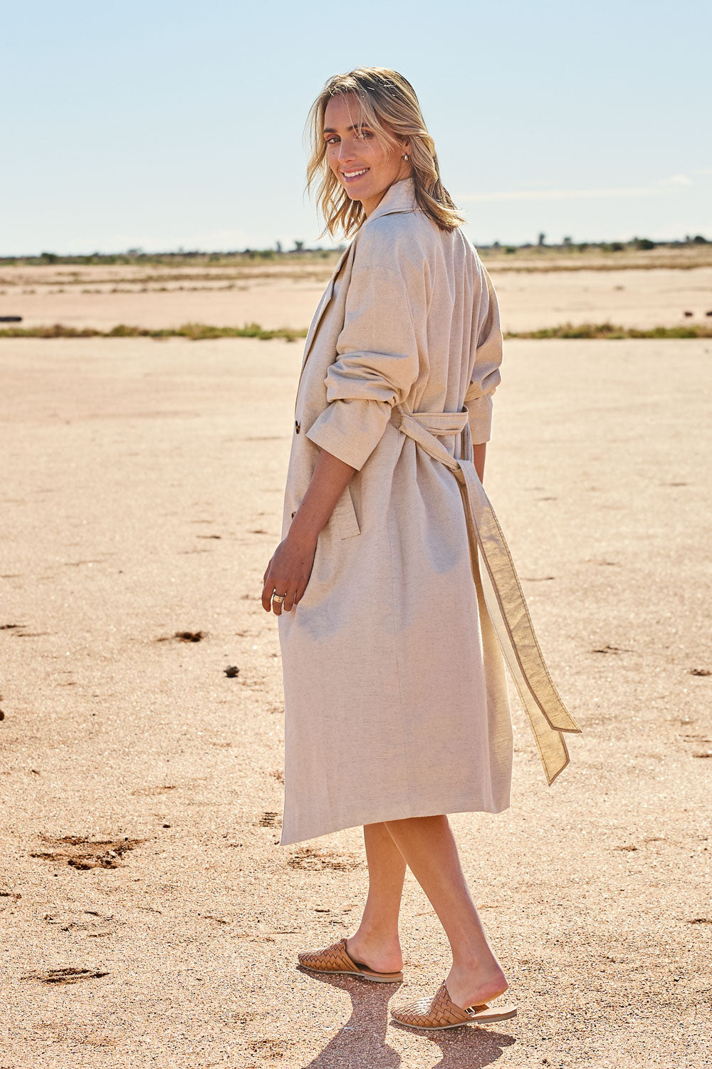 Model Tegan wearing size 10 of the Summertime Love Linen Cotton Trench Coat in colour Natural, from the front, showing the whole outfit