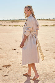 Model Tegan wearing size 10 of the Summertime Love Linen Cotton Trench Coat in colour Natural, from the front, showing the whole outfit
