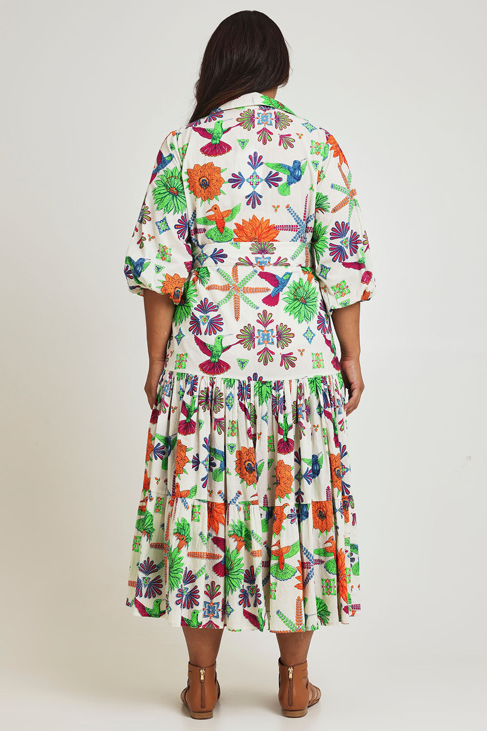 Model Ashleigh wearing size 16 of the Happy Gatherings Short Sleeved Cotton Dress in colour Brightbird, from the back