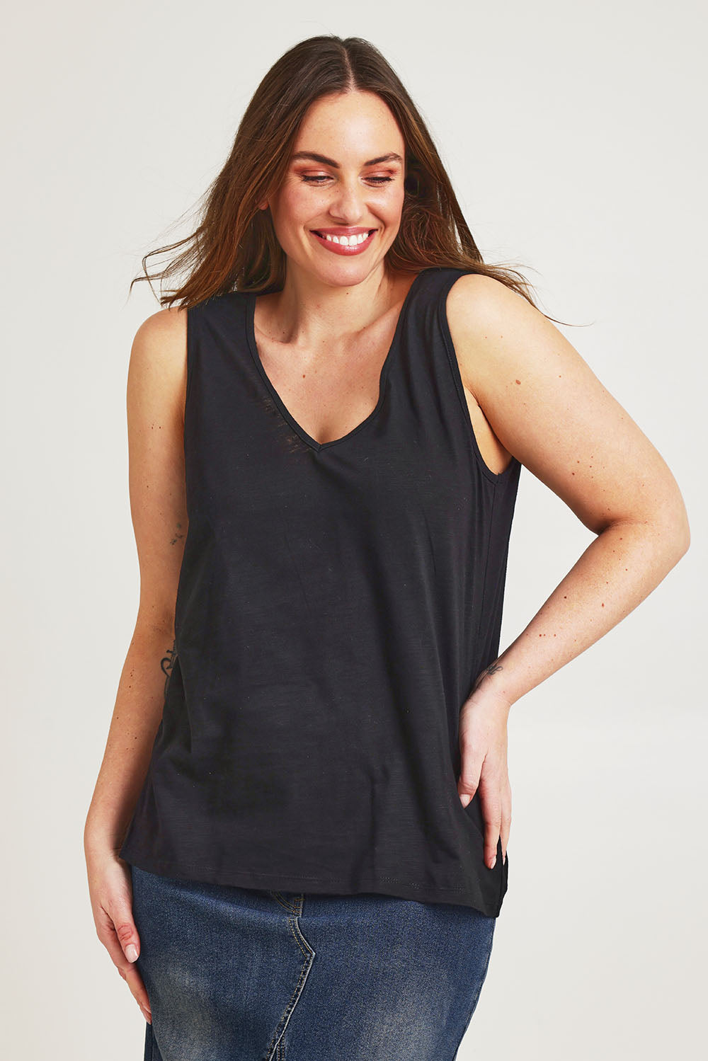 Model Jane wearing size 14 of the Need You Double Vee Tank in colour Black (Black), from the front, cropped image