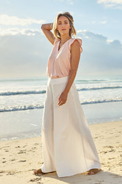 Model Tegan wearing size 10 of the Delight Me High Waisted Linen Pants in colour White (White), from the front, showing the whole outfit