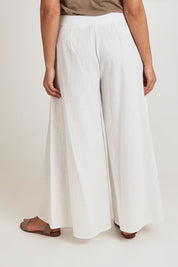Model Terri-Leigh wearing size 14 of the Delight Me High Waisted Linen Pants in colour White (White), from the back