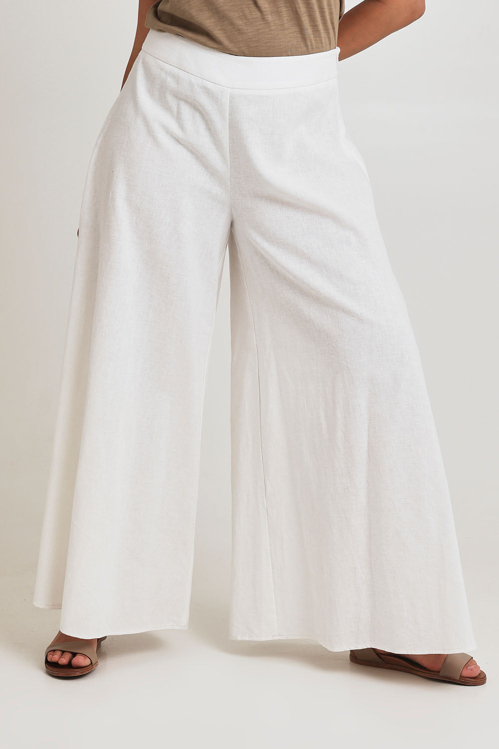 Model Terri-Leigh wearing size 14 of the Delight Me High Waisted Linen Pants in colour White (White), from the front, cropped image