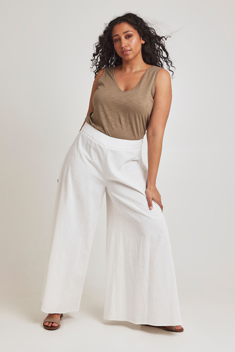 Model Terri-Leigh wearing size 14 of the Delight Me High Waisted Linen Pants in colour White (White), from the front, showing the whole outfit
