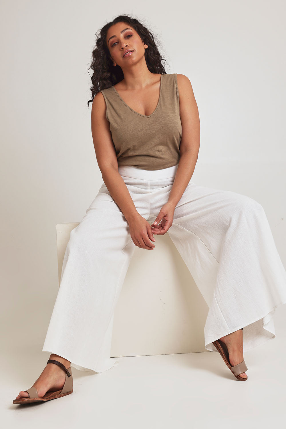 Model Terri-Leigh wearing size 14 of the Delight Me High Waisted Linen Pants in colour White (White), from the front, showing the whole outfit