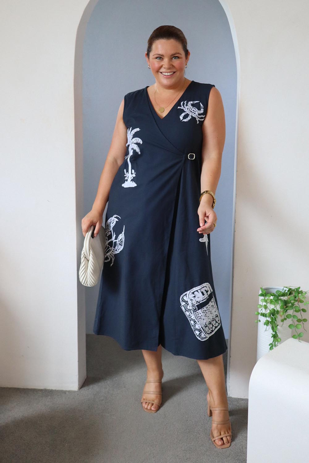 Model Stacey wearing size 14 of the By The Seaside Embroidered Cotton Jumpsuit in colour Navy (Blue), from the front, showing the whole outfit