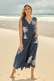 Model Tegan wearing size 10 of the By The Seaside Embroidered Cotton Jumpsuit in colour Navy (Blue), from the front, showing the whole outfit