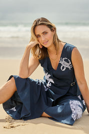 Model Tegan wearing size 10 of the By The Seaside Embroidered Cotton Jumpsuit in colour Navy (Blue), from the front, showing the whole outfit