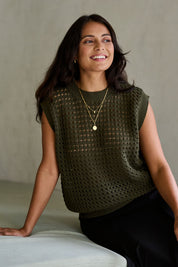 Model Tahnee wearing size S of the Love Language Cotton Vest in colour Forest (Green), from the front, showing the whole outfit