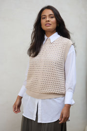 Model Tahnee wearing size S of the Love Language Cotton Vest in colour Natural, from the front, showing the whole outfit