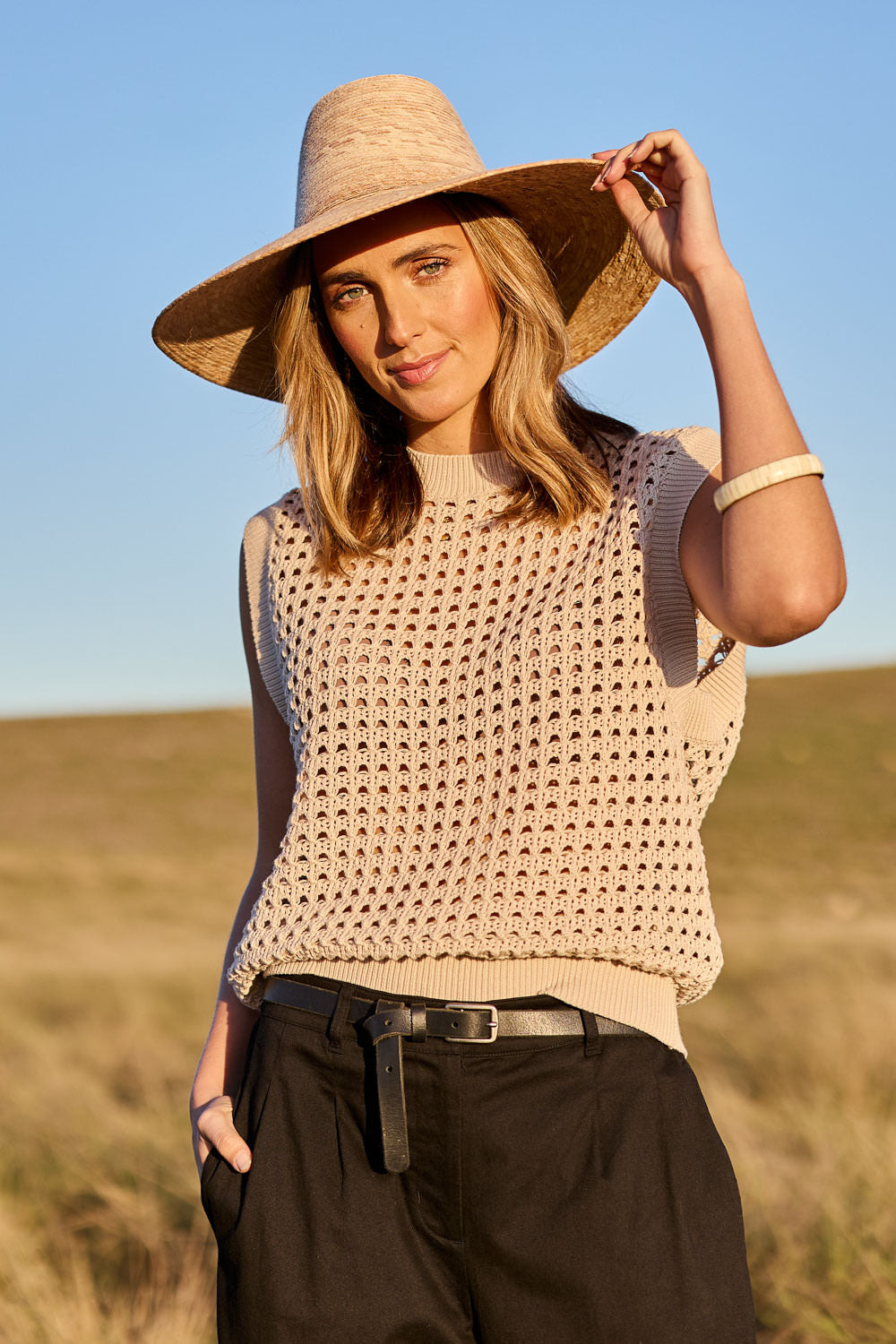 Model Tegan wearing size S of the Love Language Cotton Vest in colour Natural, from the front, showing the whole outfit
