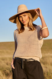 Model Tegan wearing size S of the Love Language Cotton Vest in colour Natural, from the front, showing the whole outfit