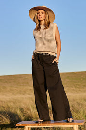 Model Tegan wearing size S of the Love Language Cotton Vest in colour Natural, from the front, showing the whole outfit