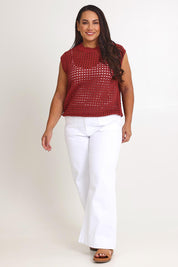 Model Ashleigh wearing size XL of the Love Language Cotton Vest in colour Rust, from the front, showing the whole outfit
