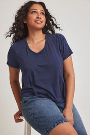 Model Terri-Leigh wearing size 14 of the Saturday Night Low Back Tee in colour Marledenim (Blue), from the front, cropped image