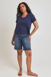 Model Terri-Leigh wearing size 14 of the Saturday Night Low Back Tee in colour Marledenim (Blue), from the front, showing the whole outfit
