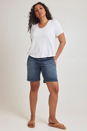 Model Terri-Leigh wearing size 14 of the Saturday Night Low Back Tee in colour White (White), from the front, showing the whole outfit