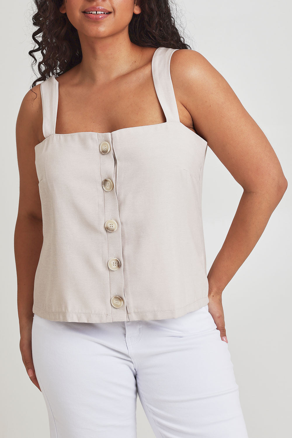 Model Terri-Leigh wearing size 14 of the Striding Out Button Through Tank Vest in colour Moet, from the front, cropped image