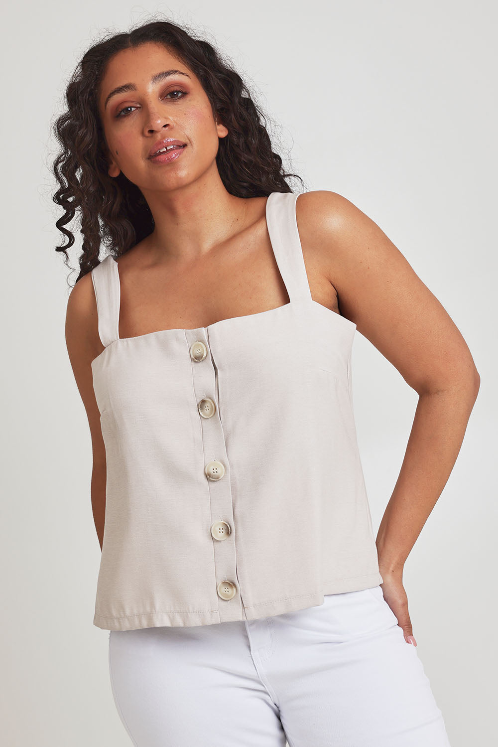 Model Terri-Leigh wearing size 14 of the Striding Out Button Through Tank Vest in colour Moet, from the front, cropped image