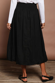 Model Amanda wearing size 10 of the Bubble Delight Cotton Skirt in colour Black (Black), from the back