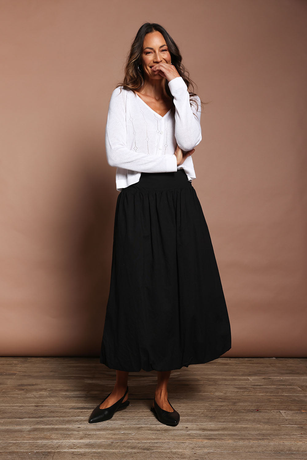 Model Amanda wearing size 10 of the Bubble Delight Cotton Skirt in colour Black (Black), from the front, showing the whole outfit