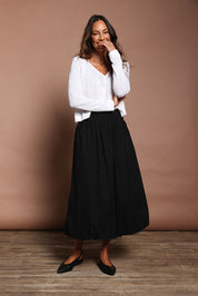 Model Amanda wearing size 10 of the Bubble Delight Cotton Skirt in colour Black (Black), from the front, showing the whole outfit