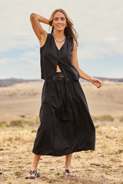 Model Tegan wearing size 10 of the Bubble Delight Cotton Skirt in colour Black (Black), from the front, showing the whole outfit