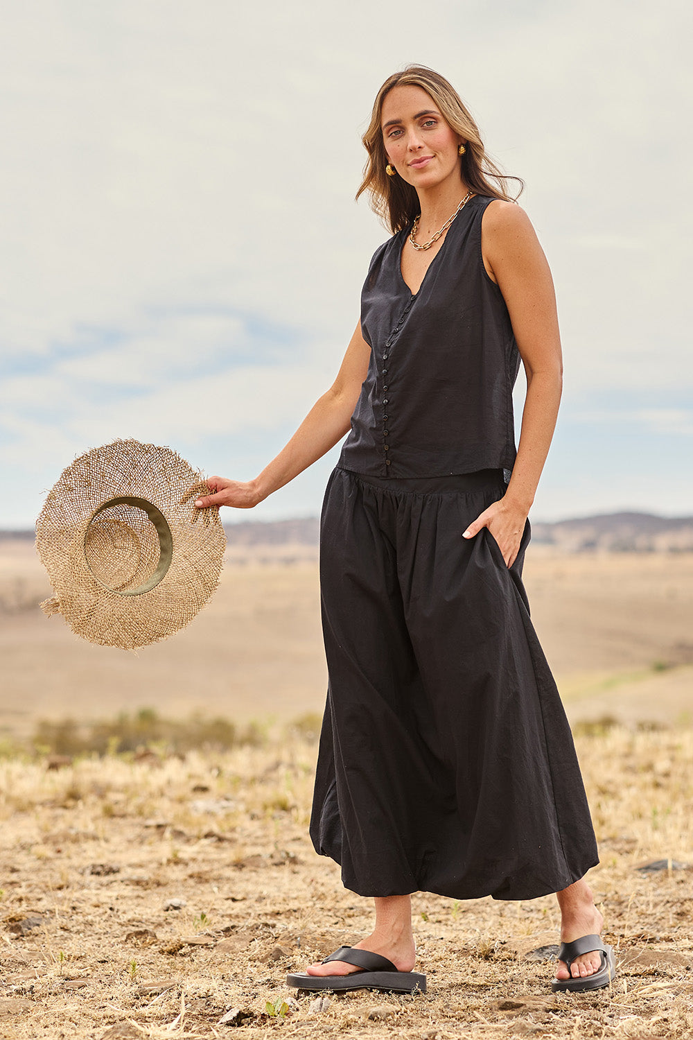 Model Tegan wearing size 10 of the Bubble Delight Cotton Skirt in colour Black (Black), from the front, showing the whole outfit