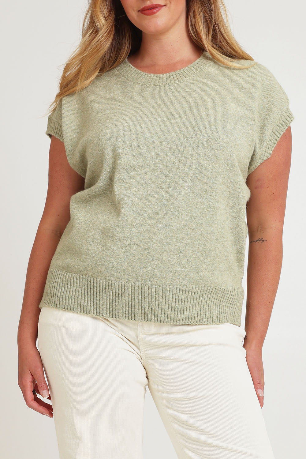 Model Chanel wearing size XL of the Found My Friend Recycled Knit Top in colour Sage (Green), from the front, cropped image