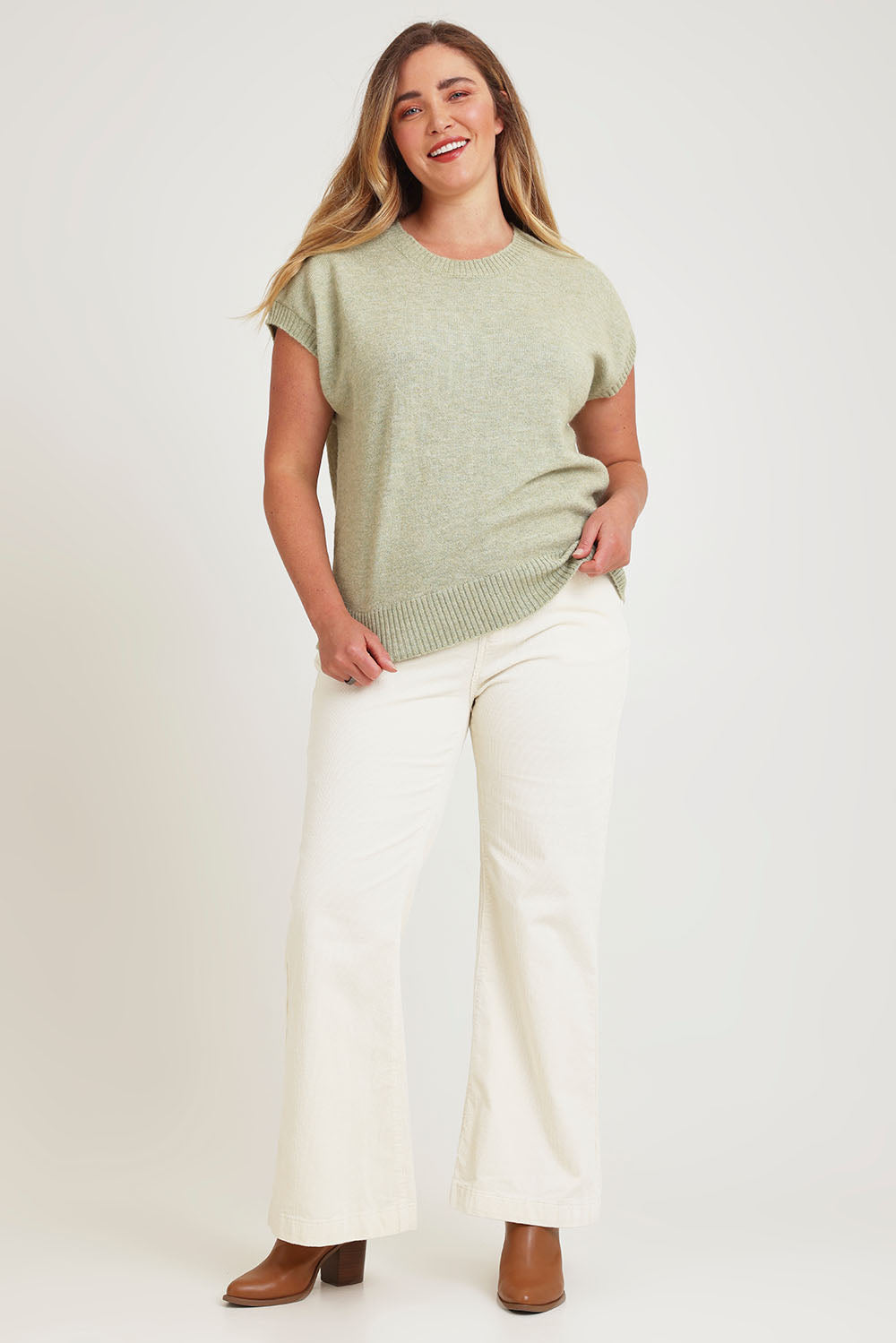 Model Chanel wearing size XL of the Found My Friend Recycled Knit Top in colour Sage (Green), from the front, showing the whole outfit