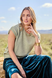 Model Tegan wearing size S of the Found My Friend Recycled Knit Top in colour Sage (Green), from the front, showing the whole outfit