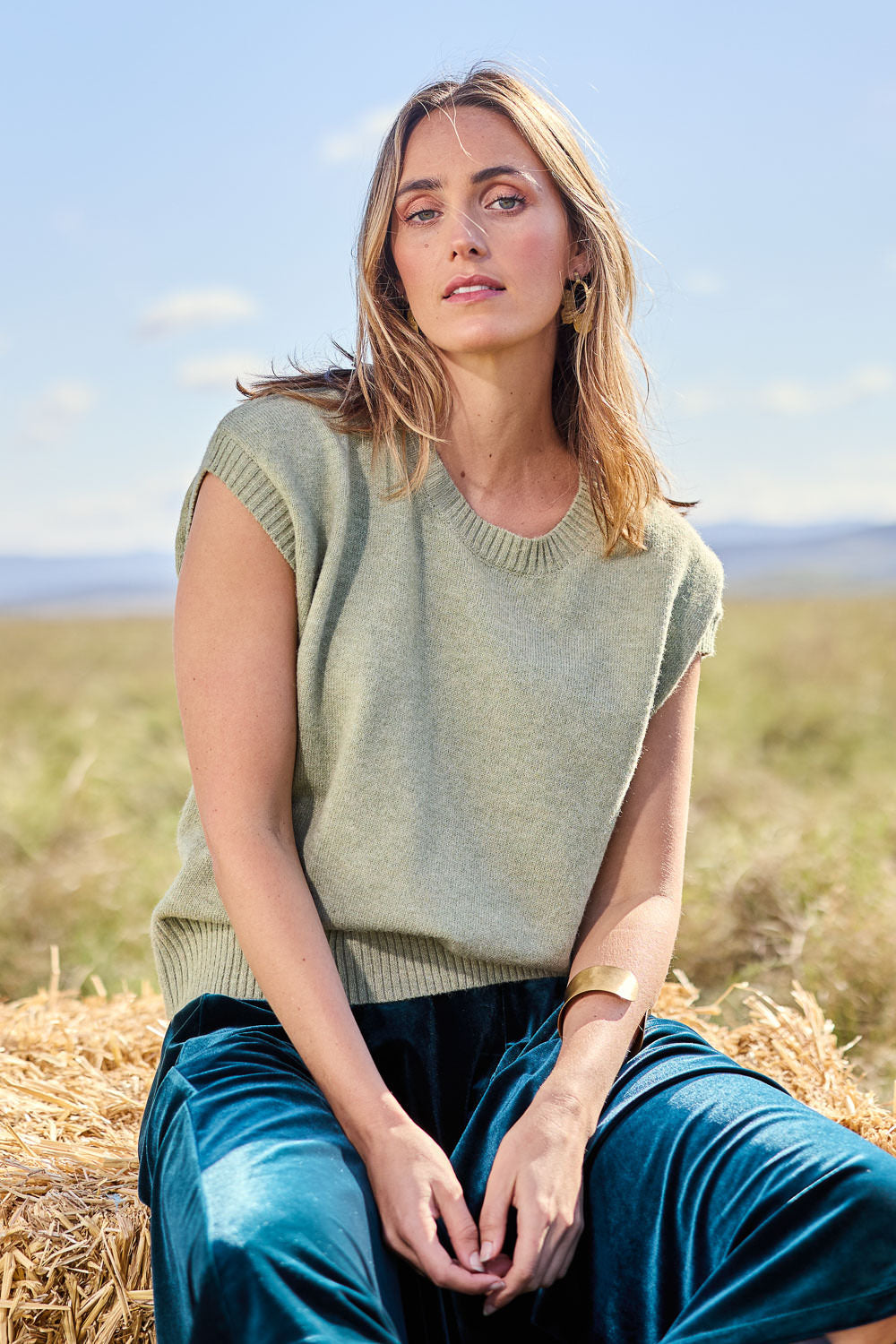 Model Tegan wearing size S of the Found My Friend Recycled Knit Top in colour Sage (Green), from the front, showing the whole outfit