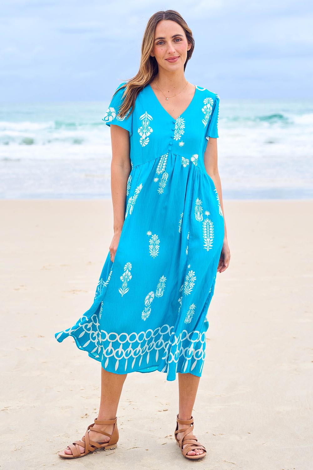 Model Tegan wearing size 10 of the Picture Perfect Midi Dress in colour Aqua (Blue), from the front, showing the whole outfit