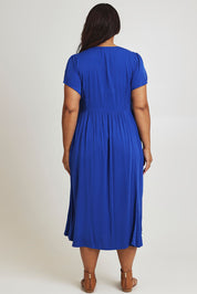 Model Ashleigh wearing size 16 of the Picture Perfect Midi Dress in colour Royal (Blue), from the back
