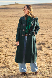 Model Tegan wearing size 10 of the Winter Walk Longline Cord Duffle Coat in colour Jade (Green), from the front, showing the whole outfit