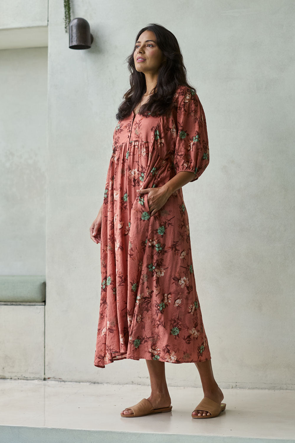 Model Tahnee wearing size 10 of the Full Of Sunshine Midi Dress in colour Clayfleur, from the front, showing the whole outfit