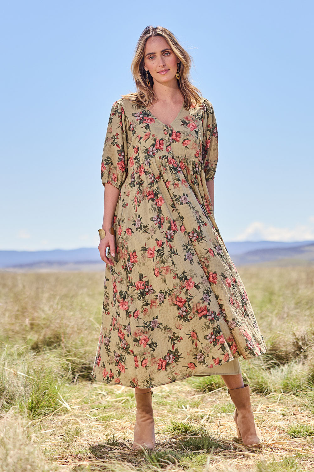 Model Tegan wearing size 10 of the Full Of Sunshine Midi Dress in colour Sagefleur (Green), from the front, showing the whole outfit